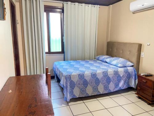 Ένα ή περισσότερα κρεβάτια σε δωμάτιο στο Hostel Terra Mãe