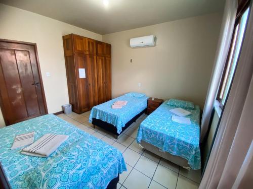 Ένα ή περισσότερα κρεβάτια σε δωμάτιο στο Hostel Terra Mãe