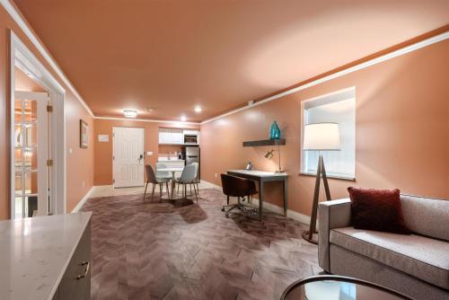 a living room with a couch and a table at The Inn at Lewisburg, BW Signature Collection in Lewisburg
