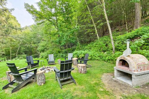 a group of chairs and a fireplace in a yard at 8 Mi to Tanglewood and Butternut Ski Spacious Home! in Housatonic