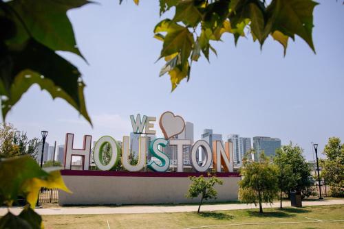 a sign for the we houston sign in the city at InterContinental Houston by IHG in Houston