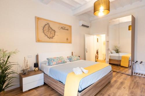 Ένα ή περισσότερα κρεβάτια σε δωμάτιο στο B&B Residenza Ricasoli Grosseto centro storico