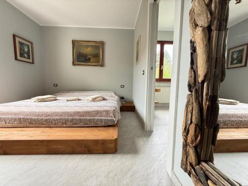 Ένα ή περισσότερα κρεβάτια σε δωμάτιο στο Villa dei Mumi