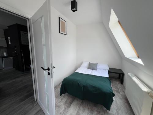 Ένα ή περισσότερα κρεβάτια σε δωμάτιο στο Apartament Culica Września