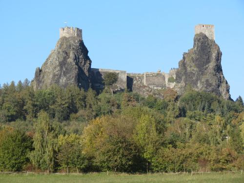 a mountain with two castles on top of it at Pension Jana - Wellness in Jilemnice