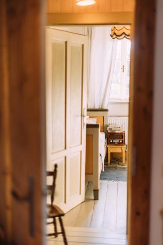 an open door to a room with a bedroom at U Květů in Milešov