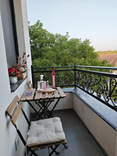a balcony with a table and chairs on a balcony at POOL RESORT Vila Lena - Lux residence apartman 1 in Vrdnik