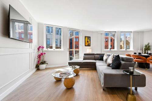 a living room with a couch and a table at The Liverpool Street Boutique in London