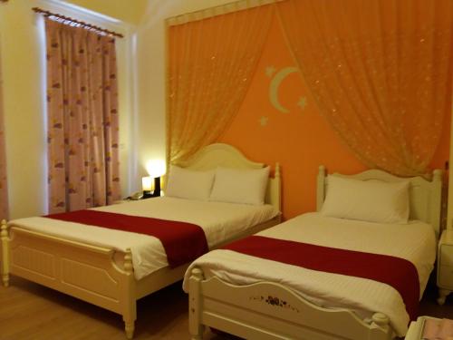 Ένα ή περισσότερα κρεβάτια σε δωμάτιο στο Money B&B