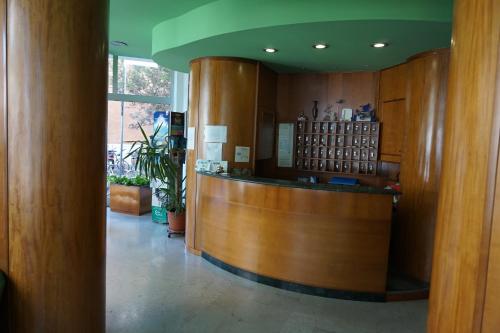 a lobby of a pharmacy with a counter at Hotel San Marco in Pesaro