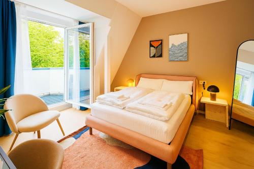 Giường trong phòng chung tại Smart Stayzz