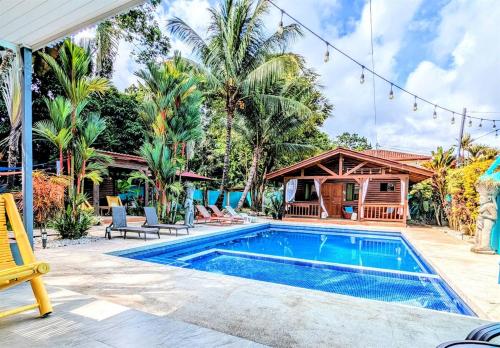 an image of a swimming pool in a house at Tropical Paradise Sapacious 1 Bed Cabina AC and Pool in Herradura