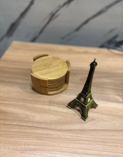 a watch and the eiffel tower on a table at Wanchaka House in Huanchaco