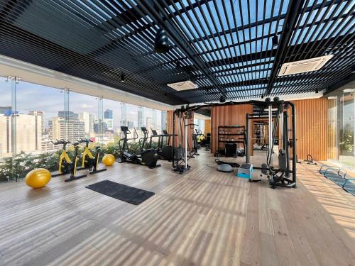 a gym with treadmills and exercise equipment in a building at I811 LOFT AC premium amenities in Mexico City
