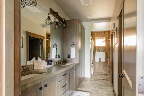 a bathroom with two sinks and a hallway at Dreamy Views, Pool Access, Game Room, Fire Pit in Ronald