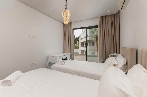 Кровать или кровати в номере appartement résidence hivernage agadir bay