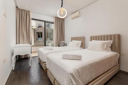 Кровать или кровати в номере appartement résidence hivernage agadir bay