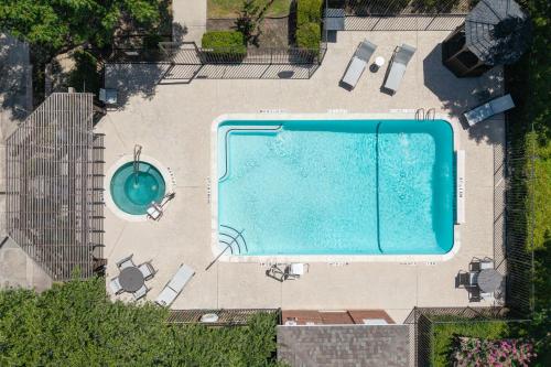 an overhead view of a swimming pool in a building at Holiday Inn Express Hotel & Suites Dallas - Grand Prairie I-20 by IHG in Grand Prairie