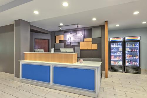 a lobby of a fast food restaurant at Holiday Inn Express Hotel & Suites Dallas - Grand Prairie I-20 by IHG in Grand Prairie