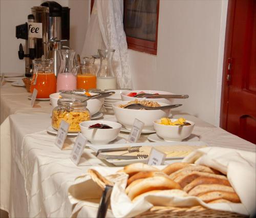a table with bread and other food on it at Hotel Valle Mistico in Ollantaytambo