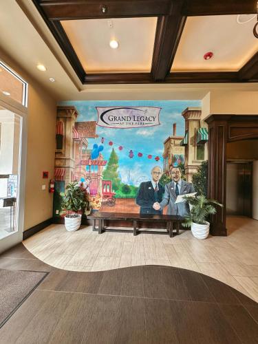 a mural in a lobby with a painting of two men at Grand Legacy At The Park in Anaheim