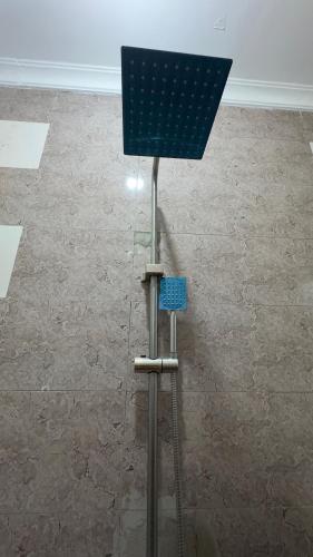 a blue object in a room with a tile floor at Grace Haven Airport Day-Use & Overnight Stays Hotel in Dar es Salaam