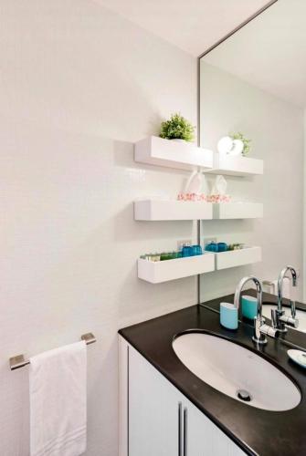 a bathroom with a sink and a mirror at Il Ciasso Romantic Seafront Escape in Vernazza