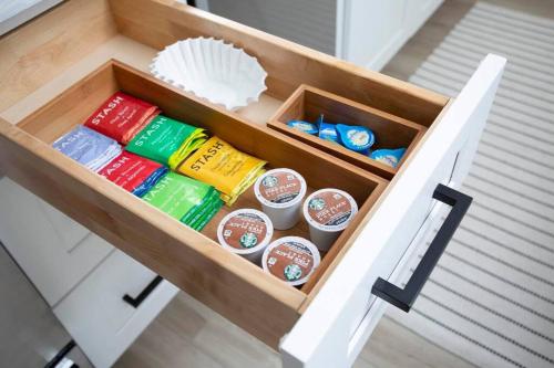 a drawer filled with different colored condiments at Stylish, Elegant, Modern, King Bed in San Diego
