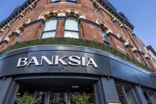 a red brick building with the name of the bankka leeds at Hotel Indigo Leeds by IHG in Leeds