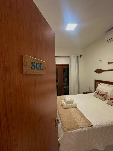 a room with a bed with a sold sign on the door at Casa Príncipe Atins in Atins