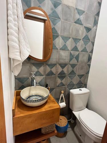 a bathroom with a sink and a mirror at Casa Príncipe Atins in Atins