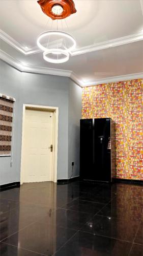 an empty room with a wall with a ceiling at Beautiful 5 bedroom Bungalow in Ibadan