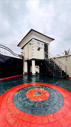 a building with a large red circle in front of it at Beautiful 5 bedroom Bungalow in Ibadan