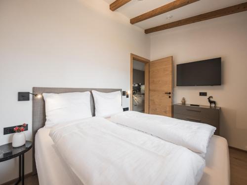 Ένα ή περισσότερα κρεβάτια σε δωμάτιο στο Stylish apartment in Kirchberg in Tirol