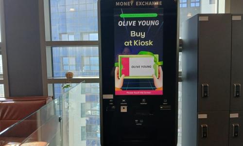 an atm machine with a sign that says online young buy off music at D OV Haeundae Hotel in Busan