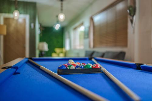a pool table with a tray of balls on it at Birmingham House in Birmingham