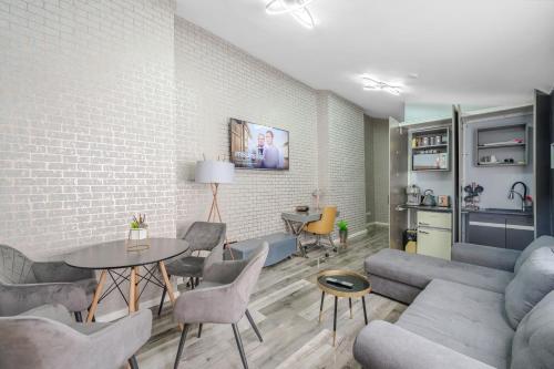 a living room with a couch and a table and chairs at Birmingham House in Birmingham