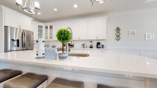 a white kitchen with a large white counter top at New Construction - West End PCB - Gated Neighborhood - FLPCB63 in Panama City Beach