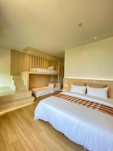 Cama o camas de una habitación en Punn Hotel Korat