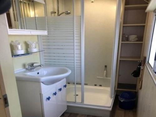 a bathroom with a sink and a shower and a tub at Auw Farm Life Escape in Auw