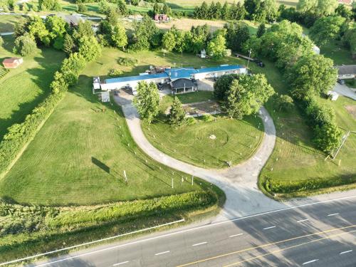 an overhead view of a building on a field with a road at Pleasant Stay Motel in Ancaster