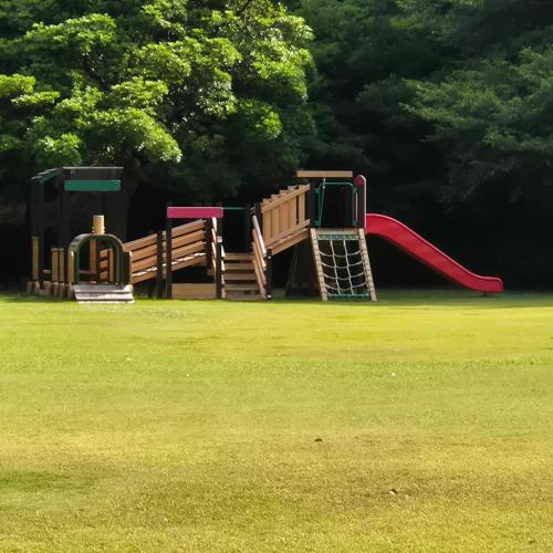 a playground with a slide in a park at 대마도쇼핑구마에하우스 in Tsushima