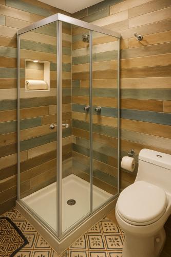 a shower stall with a toilet in a bathroom at Casa Hotel Sweet Home Apt 203 Bed & Breakfast Grupos in Medellín