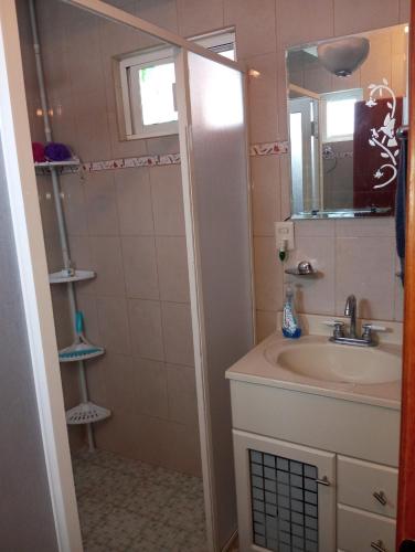 a bathroom with a sink and a mirror at Los Malvones in Tequisquiapan