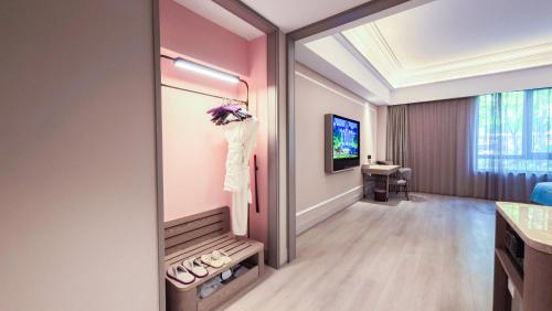 a dressing room with a mirror and a dressing table at Mercure Beijing Downtown in Beijing
