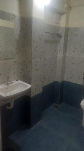 a bathroom with a sink and a shower at Sivahari Homestay in Trivandrum