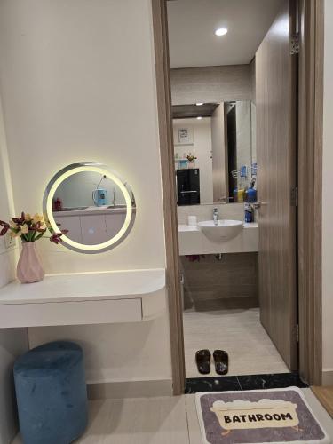 a bathroom with a mirror and a sink at Happy Home S112 in Gia Lâm Pho