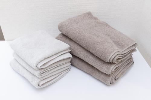 a pile of towels sitting on top of a counter at メルディア東堀切 in Tokyo