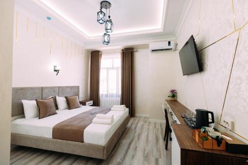 Кровать или кровати в номере YURT Hotel