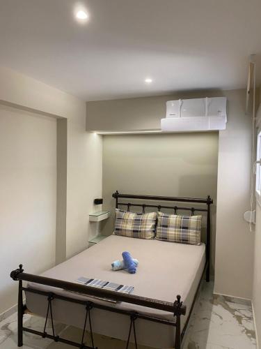 a bedroom with a bed with a box on top at Chalkida Hilltop Apartments in Chalkida